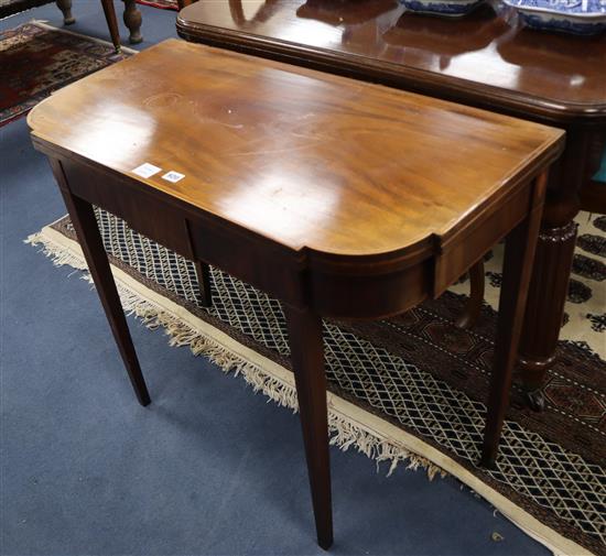 A George III inlaid mahogany folding tea table W.92cm